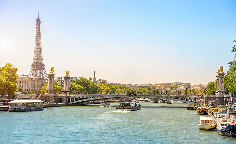 Eiffel Tower and Bridge Alexandre III over Seine River Paris