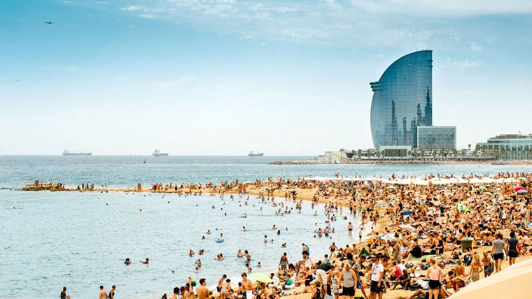 Panoramic image of Barceloneta beach Unmissable Barcelona Experiences